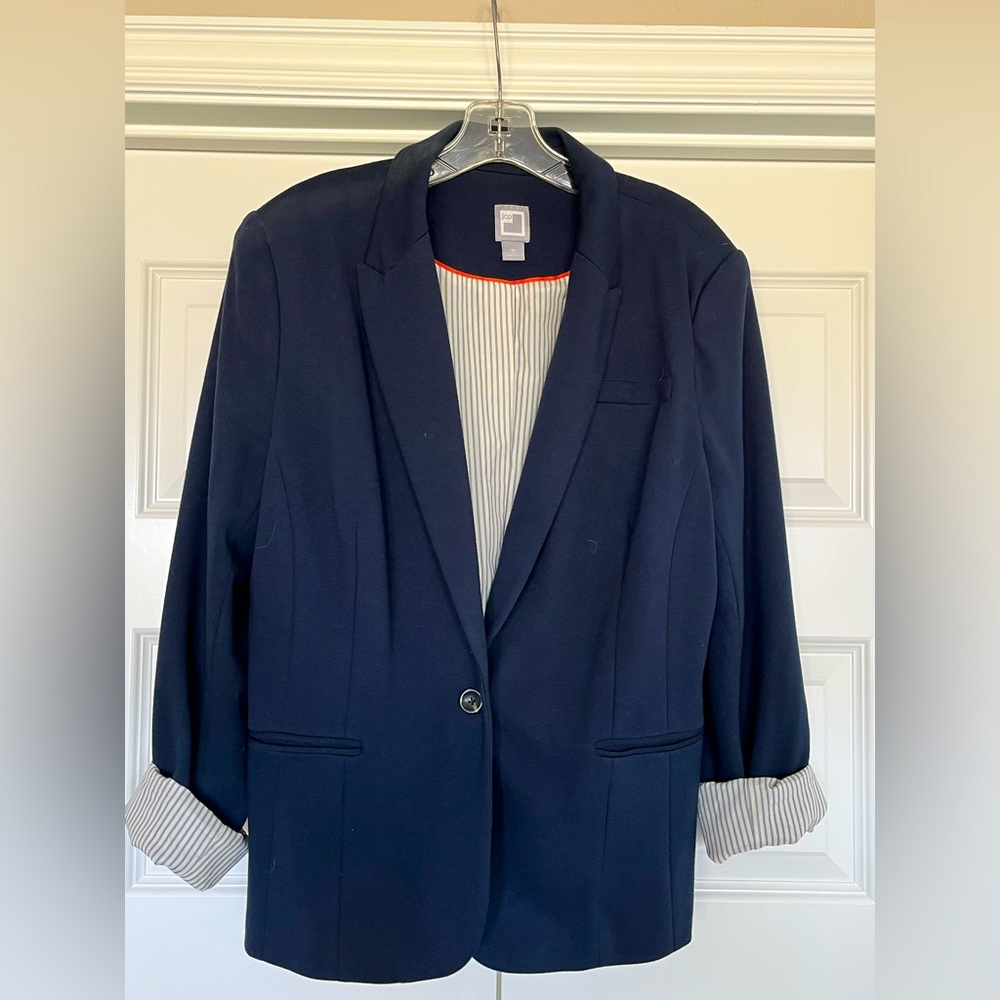 Navy blazer, fully lined with pin stripe fabric. One button closure.